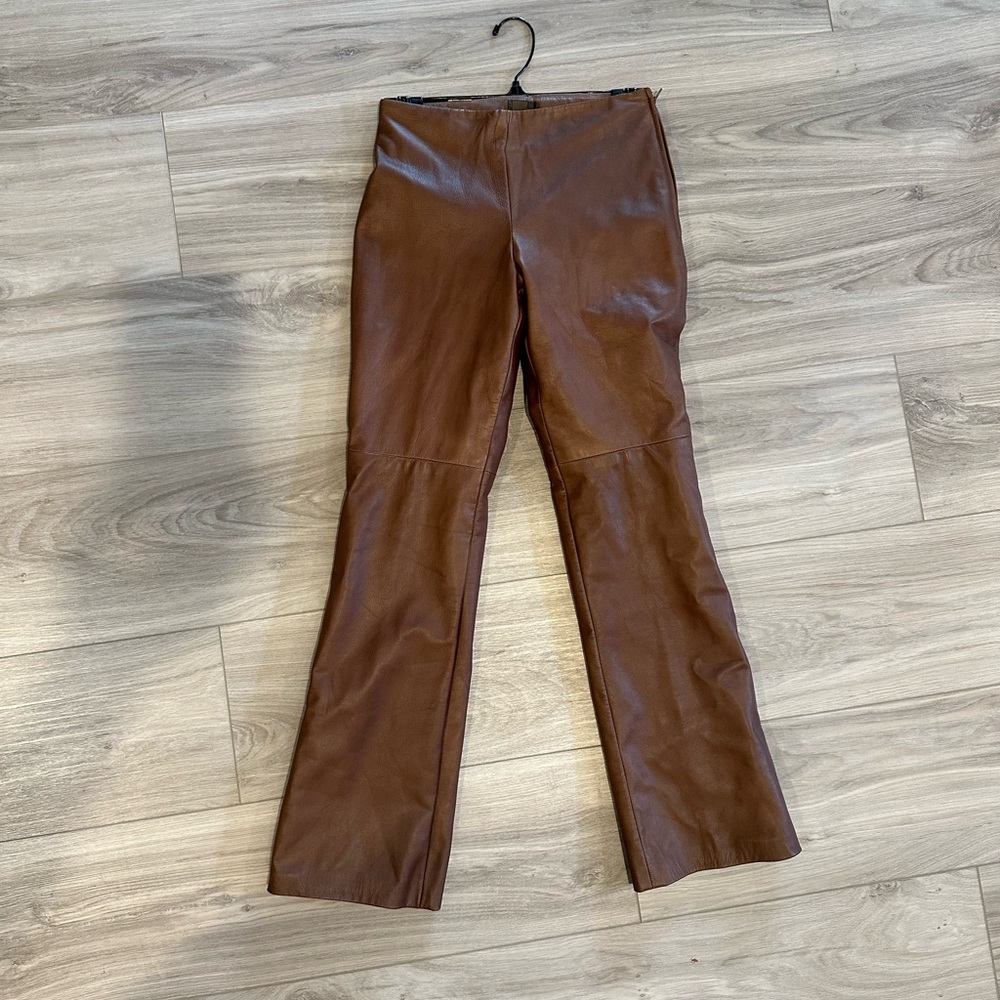 Women’s vintage genuine brown leather pants by Danier leather. Size 0, petite.